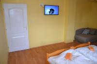 A bed or beds in a room at Penzion Chalupka
