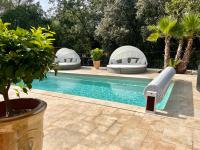 a pool with a water slide in a backyard at La Casa dei Sogni in Flayosc