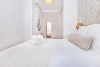 A bed or beds in a room at Victoria City Center Apartment