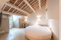 Łóżko lub łóżka w pokoju w obiekcie Hotel Villa I Pini