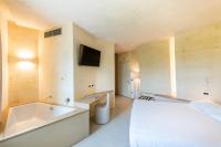 Łóżko lub łóżka w pokoju w obiekcie Hotel Villa I Pini