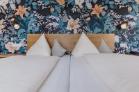 Łóżko lub łóżka w pokoju w obiekcie Landhotel Gschirnwirt