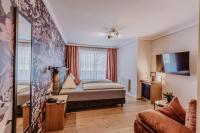 Łóżko lub łóżka w pokoju w obiekcie Landhotel Gschirnwirt