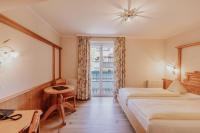 Łóżko lub łóżka w pokoju w obiekcie Landhotel Gschirnwirt
