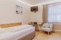 Łóżko lub łóżka w pokoju w obiekcie Landhotel Gschirnwirt