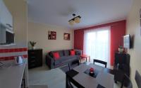 Televízia a/alebo spoločenská miestnosť v ubytovaní Apartament Zdrojowy Jastrzębia Góra