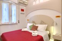 A bed or beds in a room at La Chicca Pontevecchio