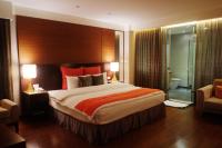Tempat tidur dalam kamar di Aqua Bella Hotel