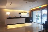 a lobby with a reception desk in a building at Aqua Bella Hotel in Taipei