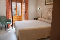 Cama o camas de una habitación en Hotel Manzanito