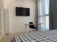 TV a/nebo společenská místnost v ubytování MonKeys Apartments Pagés del Corro Triana