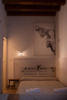 A bed or beds in a room at 4 Camere A Trani