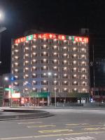 a large building with lights on top of it at night at Centre Hotel in Kaohsiung
