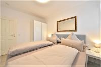 Postel nebo postele na pokoji v ubytování Villa Vivaldi - Ferienwohnung 3