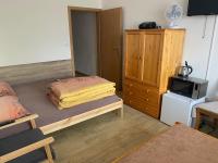 Postel nebo postele na pokoji v ubytování Rybářská restaurace a penzion u Horáků