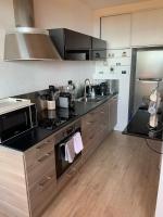 Kuchyňa alebo kuchynka v ubytovaní Appartement « Marinella » splendide vue mer aux Sanguinaires