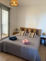 Posteľ alebo postele v izbe v ubytovaní Appartement « Marinella » splendide vue mer aux Sanguinaires