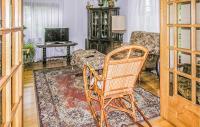Televízia a/alebo spoločenská miestnosť v ubytovaní Holiday Home Dywity Wielochowo