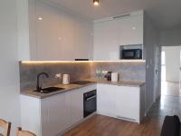 Kuchyňa alebo kuchynka v ubytovaní NEW APARTMENT Wołyńska - przestronny, z widokiem, czysto, parking, balkon