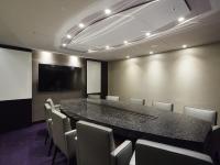 a conference room with a long table and chairs at The Tango Hotel Taipei FuHsing in Taipei