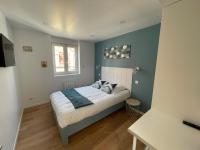 Posteľ alebo postele v izbe v ubytovaní l'étoile de mer - appartement le bord de mer