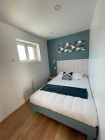 Posteľ alebo postele v izbe v ubytovaní l'étoile de mer - appartement le bord de mer