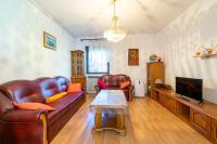a living room with leather furniture and a tv at Apartments with a parking space Bibinje, Zadar - 18275 in Bibinje