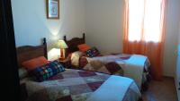 Cama o camas de una habitación en Hostal Rural Molino Del Bombo