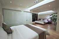 a bedroom with a large white bed and a couch at Han-Shian Boutique B&amp;B in Dongshan