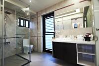 a bathroom with a shower and a sink and a toilet at Han-Shian Boutique B&amp;B in Dongshan