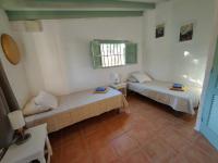 A bed or beds in a room at Cortijo Vacas Gordas Villas