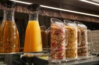 a group of containers of food and orange juice at Hotel Orsaria in Venice