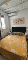 A bed or beds in a room at EN EL CORAZON DE GRANADA