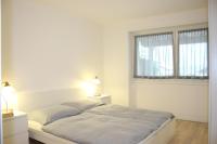 Łóżko lub łóżka w pokoju w obiekcie Rose Gialla Firsia Garten Ferienwohnung EG