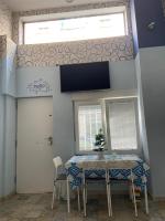 Televízia a/alebo spoločenská miestnosť v ubytovaní Urban Loft