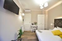 Televízia a/alebo spoločenská miestnosť v ubytovaní Sacconi Palace Suite Roma