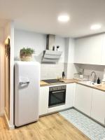 Kuchyň nebo kuchyňský kout v ubytování Grup D'Aro Apartment