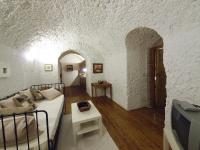 Posezení v ubytování Casas Cueva y Cortijo La Tala en Guadix