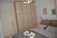 Posteľ alebo postele v izbe v ubytovaní Anastasias apartment tripoli