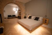 Łóżko lub łóżka w pokoju w obiekcie S1 Luxury Suites and Rooms