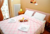 A bed or beds in a room at Hotel Aoos