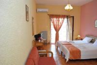 A bed or beds in a room at Hotel Aoos