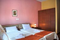 A bed or beds in a room at Hotel Aoos