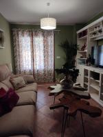 TV a/nebo společenská místnost v ubytování Apartamento completo con piscina comunitaria y patio exterior