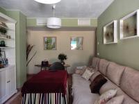Posezení v ubytování Apartamento completo con piscina comunitaria y patio exterior