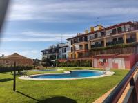 Bazén v ubytování Apartamento completo con piscina comunitaria y patio exterior nebo v jeho okolí