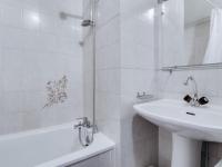 a white bathroom with a sink and a bath tub at Appartement Luz-Saint-Sauveur, 3 pièces, 6 personnes - FR-1-402-44 in Luz-Saint-Sauveur