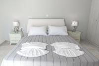 A bed or beds in a room at Vigere Luxury Villa