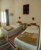 Postel nebo postele na pokoji v ubytování Seliyaa Siwa Inn Hotel