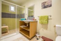 a bathroom with a sink and a shower at CHAMBRES D&#39;HOTES 2 à 4p ou GITE DE GROUPE 15p, 7 ch, 6 sdb, parc et salle de réception in Villeneuve-de-Berg
